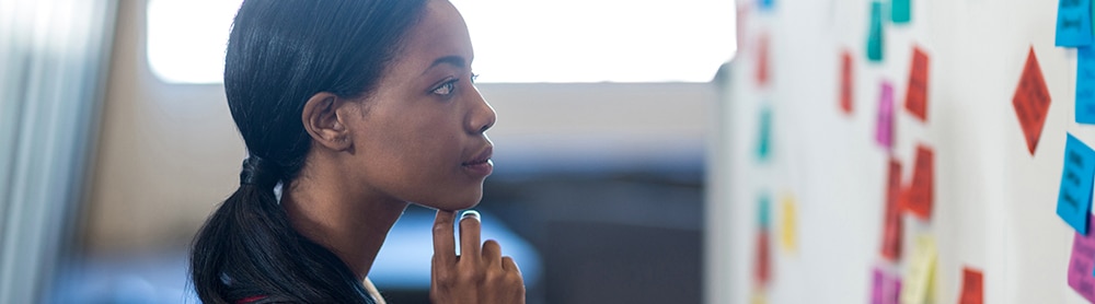 Woman looking at white board