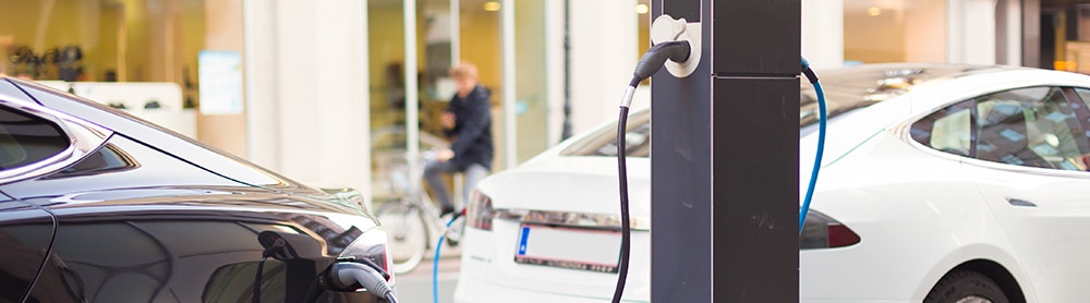 Electric vehicles charging in the street