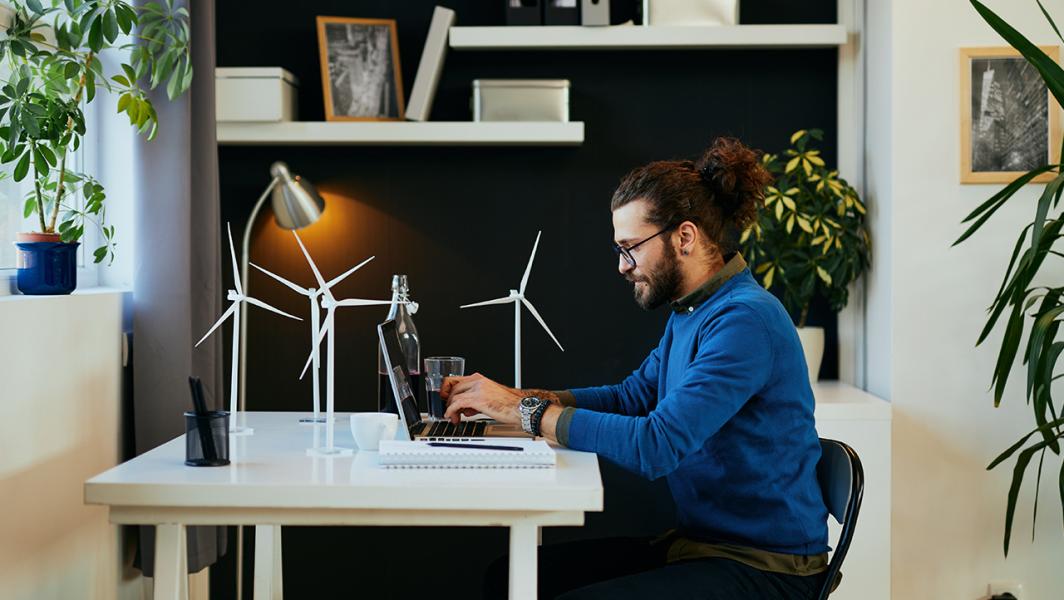 Professional working on his laptop at home
