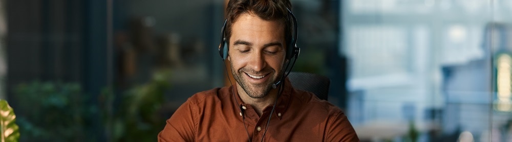 Person on laptop with headphones