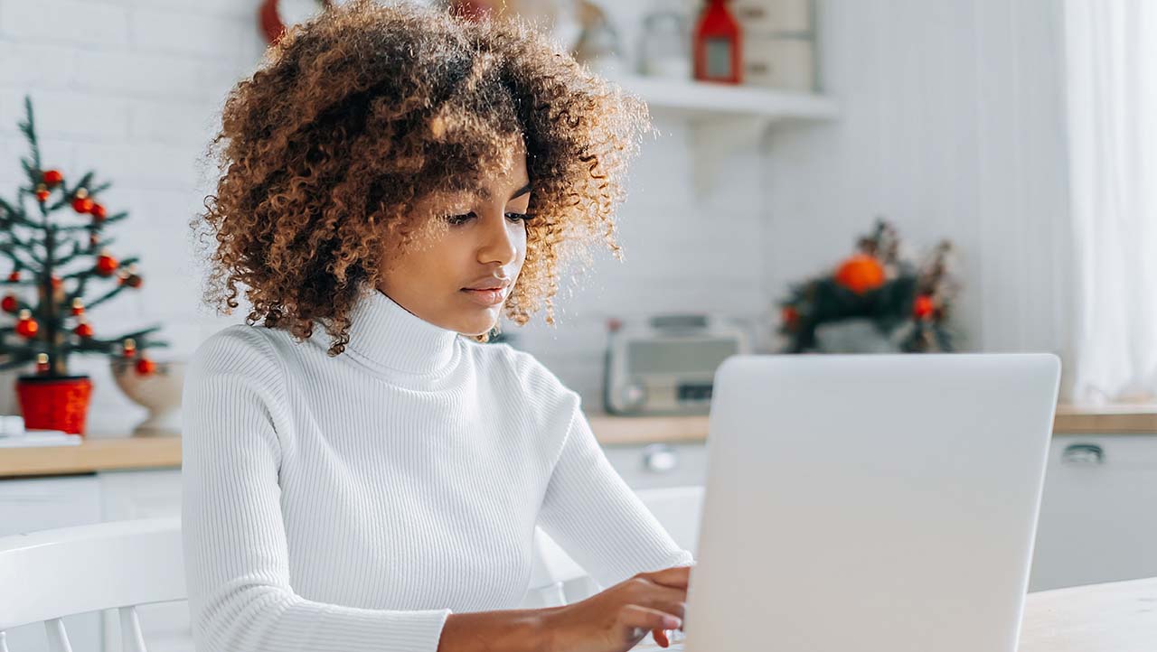 young person using laptop