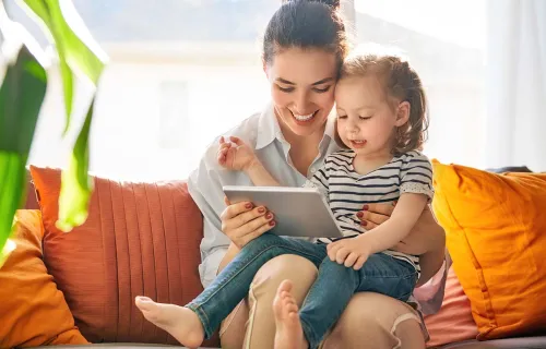 Adult and child on a tablet