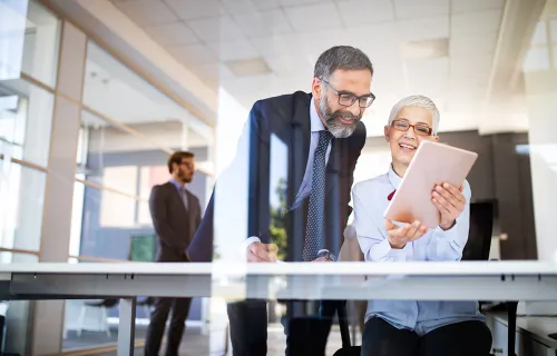 Collaboration and analysis by business people working in office