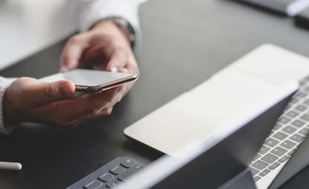 Hands of a person holding mobile