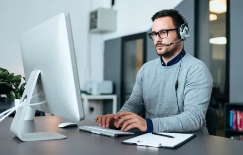 health claims auditor working on computer