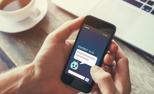 person interacting with chatbot on mobile phone