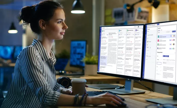 Person looking at data on computer monitor