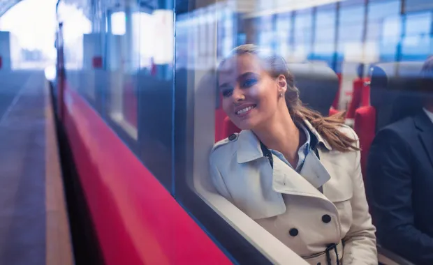female passenger looking out of a train window