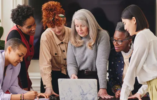 Multicultural females planning business strategy in a meeting