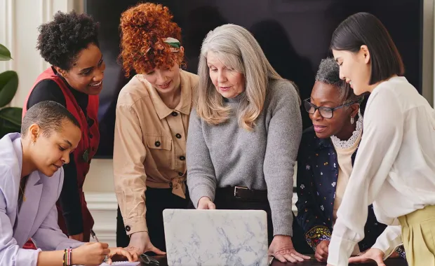 Multicultural females planning business strategy in a meeting