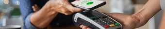 person paying for purchase via contactless mobile payment