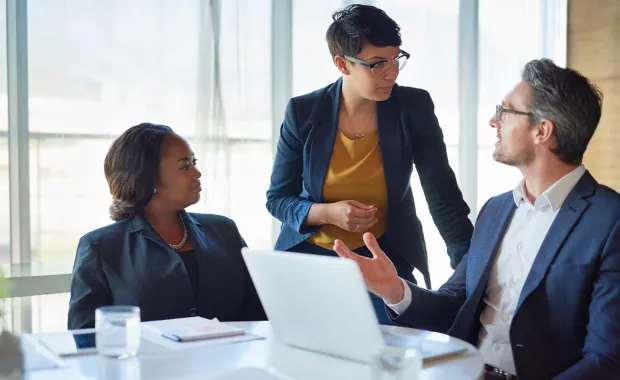 3 consultants discussing strategic alignment